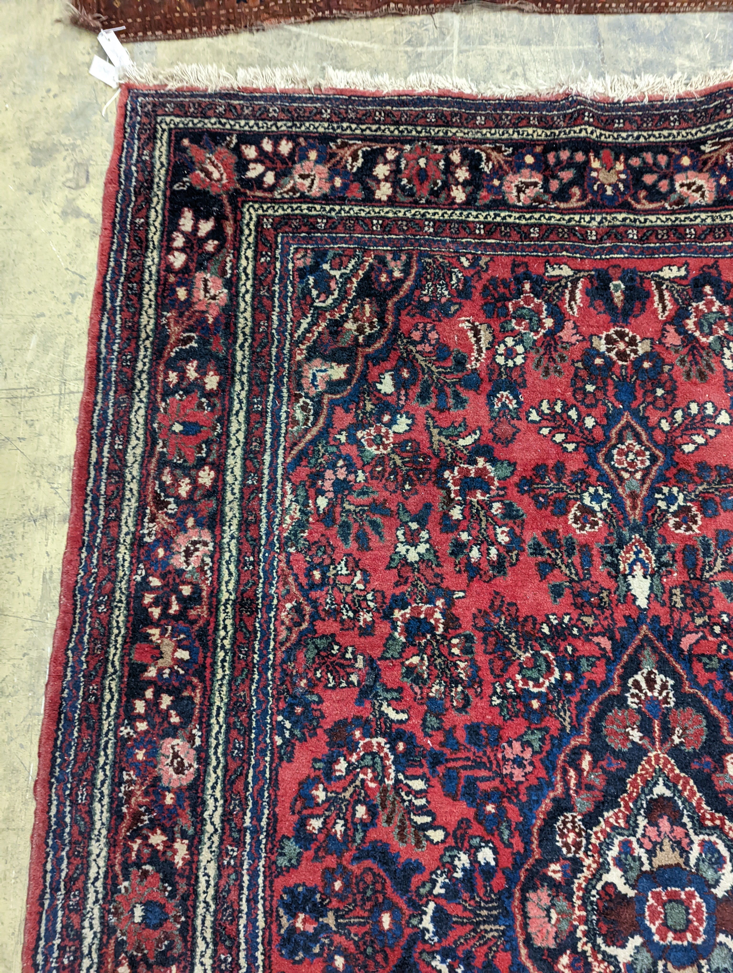 A Tabriz style red ground carpet, 290 x 190cm